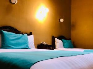 Postel nebo postele na pokoji v ubytování Hotel Boutique Casa de las Manrique