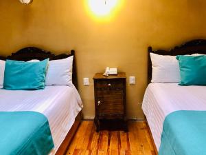 Postel nebo postele na pokoji v ubytování Hotel Boutique Casa de las Manrique