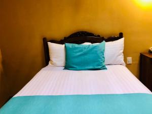Postel nebo postele na pokoji v ubytování Hotel Boutique Casa de las Manrique