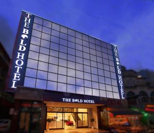 a building with a sign that reads the dub hotel at The Bold Hotel in Istanbul