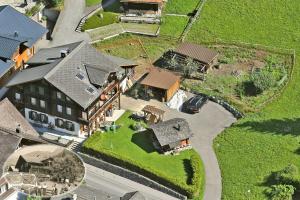 an aerial view of a house with a yard at Chalet Spillstatt in Grindelwald