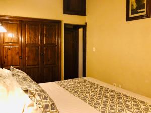 Postel nebo postele na pokoji v ubytování Hotel Boutique Casa de las Manrique