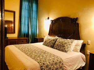 Postel nebo postele na pokoji v ubytování Hotel Boutique Casa de las Manrique