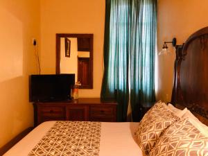 Postel nebo postele na pokoji v ubytování Hotel Boutique Casa de las Manrique