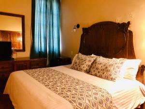 Postel nebo postele na pokoji v ubytování Hotel Boutique Casa de las Manrique