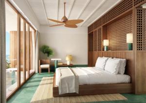 a bedroom with a bed and a ceiling fan at Baja Club Hotel, La Paz, Baja California Sur, a Member of Design Hotels in La Paz