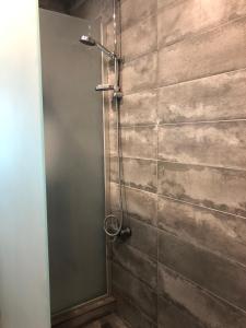 a shower with a glass door in a bathroom at 4 rooms apartment with a view of the Dnieper River in Kyiv +18 photos