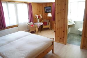 Postel nebo postele na pokoji v ubytování Hotel Alpina