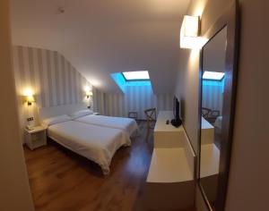 Postel nebo postele na pokoji v ubytování Hotel Pago del Olivo