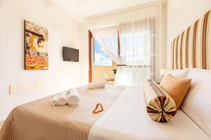 Tempat tidur dalam kamar di Sun&Sardinia
