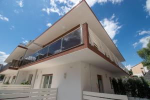 a house with a large window on the side of it at Independence House Holiday in Catania