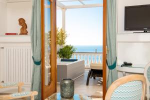 a living room with a view of the ocean at Hotel Villa Gabrisa in Positano