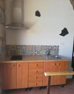 a kitchen with a sink and a counter top at Casa cueva El perucho in Güimar