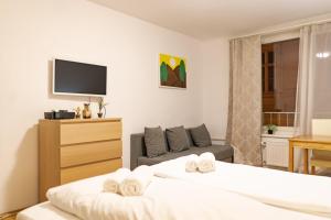 Łóżko lub łóżka w pokoju w obiekcie Central living - Stephansdom Apartments