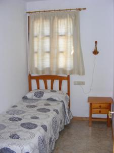 Posteľ alebo postele v izbe v ubytovaní Apartaments l'Arrel