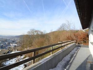 a balcony of a house with snow on the ground at Detached house with breathtaking views in Malmedy
