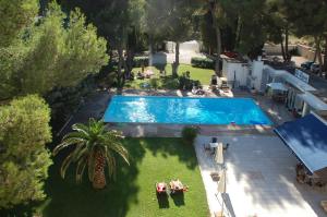 an overhead view of a swimming pool in a yard at Cit'Hotel Le Mirage in Istres