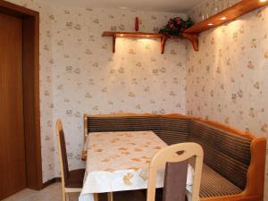 a small room with a table and chairs in it at Lovely Apartment in Beckerwitz near Terrace in Beckerwitz