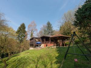 a house on top of a grassy hill at Beautiful holiday home with garden in Eichenborn
