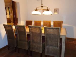 a dining room with a table and eight chairs at Holiday home in Sauerland with garden in Schmallenberg