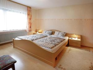 a small bedroom with a bed and a window at Apartment near the ski area in Liesen