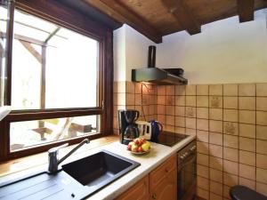 a kitchen with a sink and a window at Converted old mill in St Georgen inBlack Forest in Sankt Georgen im Schwarzwald
