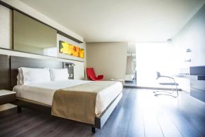 Postel nebo postele na pokoji v ubytování Inntu Hotel