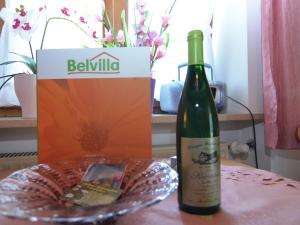 a bottle of wine and a box on a table at Ländliche Ferienwohnung, Bad Bayersoien in Bad Bayersoien