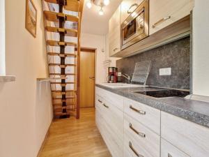 a kitchen with a sink and a counter top at Attractive holiday home in Sch nbrunn with garden in Schönbrunn