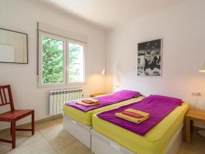 a bedroom with a bed and a desk and a chair at Belvilla by oyo villa in Pedreguer