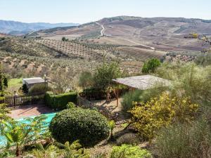 a villa with a pool and a view of the hills at Belvilla by OYO Casa Villa Campito in Villanueva de la Concepción