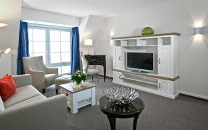 TV a/nebo společenská místnost v ubytování Hotel Rungholt