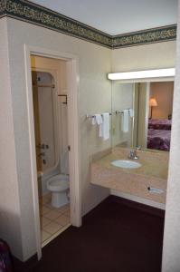 a bathroom with a sink and a toilet at Motel 6-Clarksville, TN in Clarksville