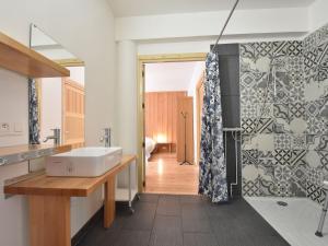 a bathroom with a sink and a shower at Modern apartment in Cuzy with shared pool in Cuzy