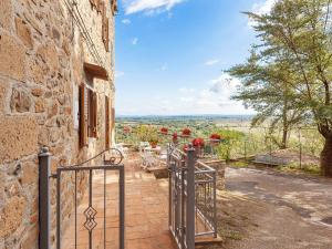 an external view of a stone building with a gate at Charmante Home with Garden in San Valentino +32 photos
