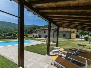 an external view of a villa with a swimming pool at Belvilla by OYO Casa Quattro in Poppi