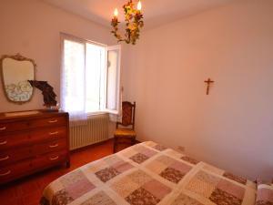 A bed or beds in a room at Holiday Home in Rio near Fishing Villages