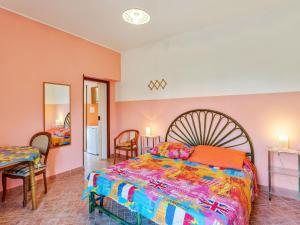 En eller flere senge i et værelse på Belvilla by OYO Vento del Mare