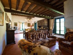 a living room with a couch and a table at Belvilla by OYO La Provincia in Sassa