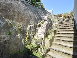 a set of stone stairs on a rock wall at Belvilla by OYO Capriccio in Ghiffa
