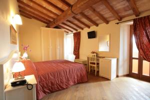 Postel nebo postele na pokoji v ubytování Hotel Villa San Michele
