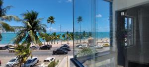 a view of the beach from a building at Apart Cote D'Azur Maceió in Maceió