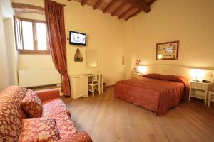 Postel nebo postele na pokoji v ubytování Hotel Villa San Michele