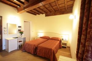 Postel nebo postele na pokoji v ubytování Hotel Villa San Michele