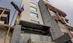 a building with the words the olivia hotel at The Onyx Hotel in Jamshedpur