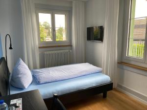 מיטה או מיטות בחדר ב-BnB Hopfengrün Langenthal