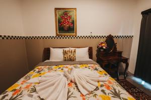 Postel nebo postele na pokoji v ubytování Dados Guest House