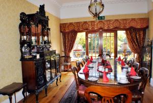 a dining room with a large table and chairs at Highfield House Guesthouse in Trim