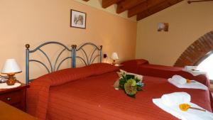 Letto o letti in una camera di Agriturismo Ai Due Volti