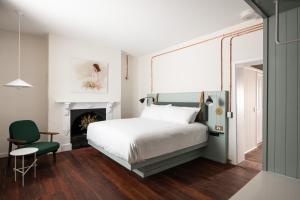 Ένα ή περισσότερα κρεβάτια σε δωμάτιο στο Garde and Warders Hotel